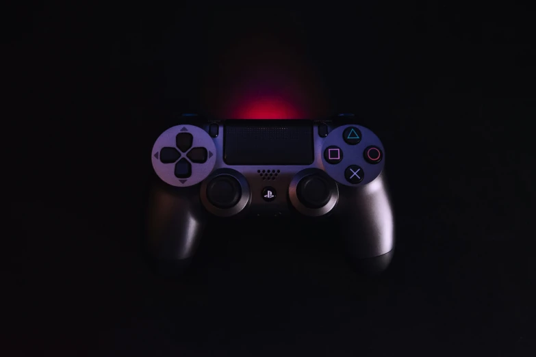 there is a video game controller that is glowing up
