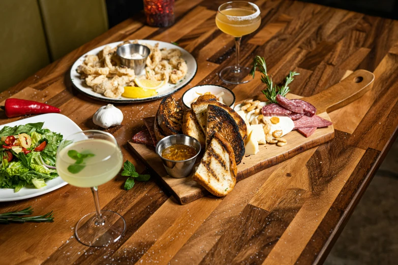 a table set with different food and drinks