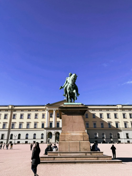 a large statue sitting in the middle of a courtyard