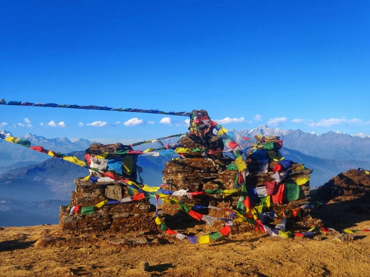 many buddhist items that are laying on a hill