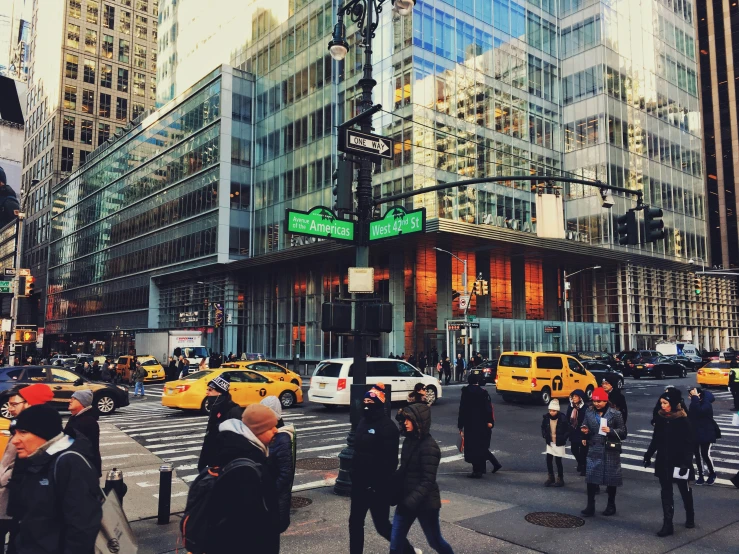 this is a busy street with many people crossing