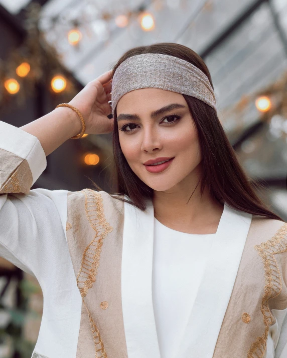 a young woman with long hair wearing a headband