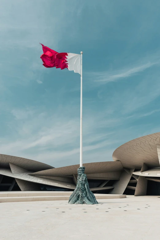 the flag of italy flying outside the italian national monument