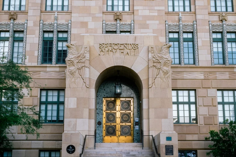 a tall building with many windows and a door