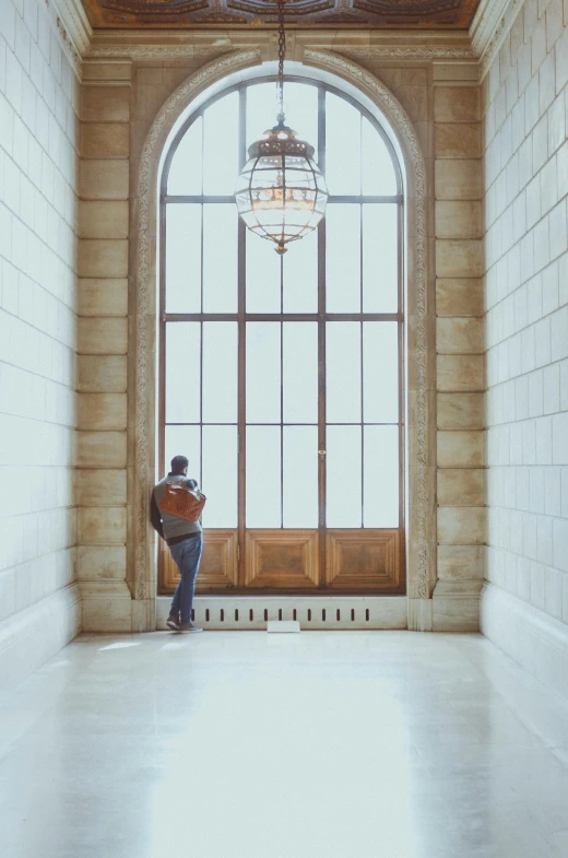 an open window with a person walking through it