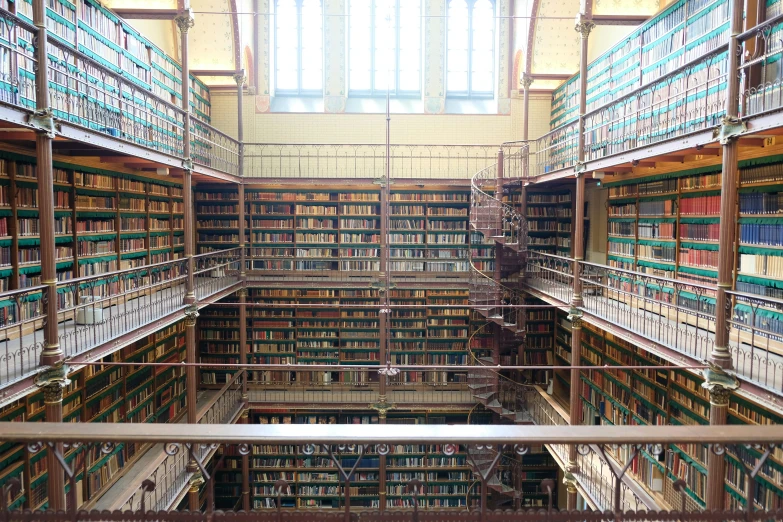 rows of books are arranged in an industrial liry