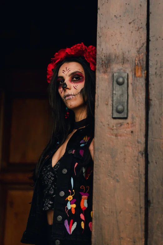 a woman in makeup and skull makeup posing
