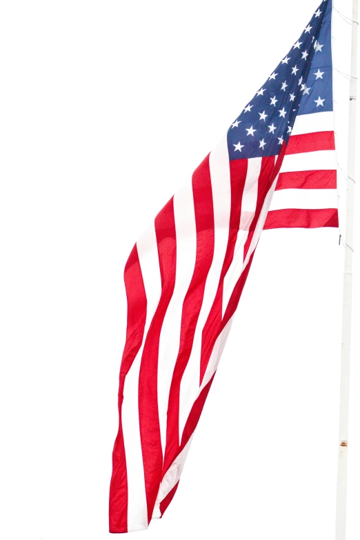 an american flag on top of a white pole
