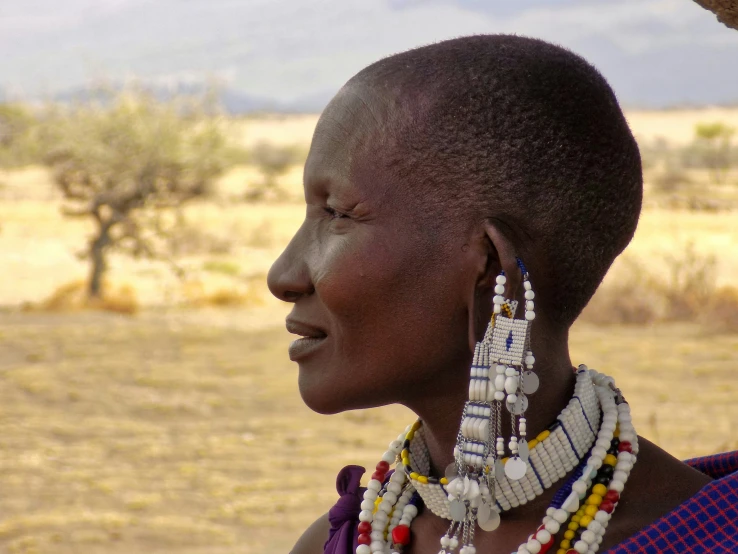 the woman with the beads is wearing a necklace