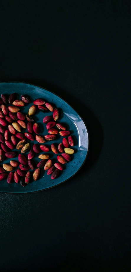 a tray with different types of peanuts in it