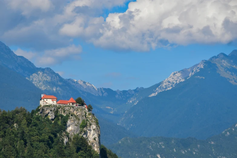 a house is built on the mountain overlooking the landscape