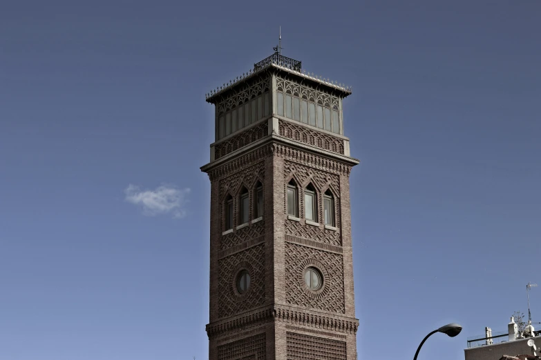 a large clock tower standing next to a tall building