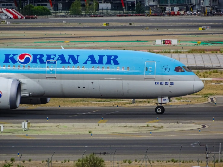 large jetliner sitting on top of an airport tarmac