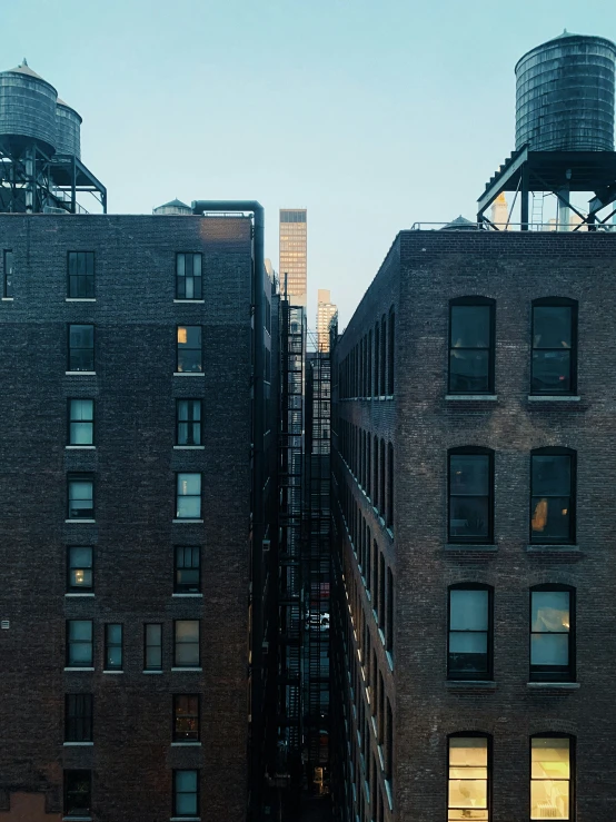 some buildings that have some water tanks on top of them