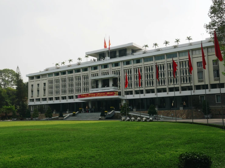 the chinese university building has many flags in it