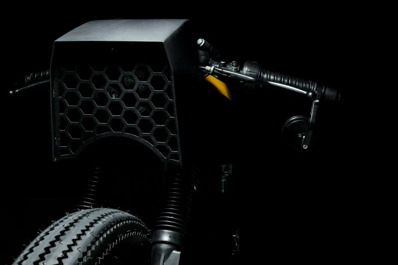 closeup of electric bike pedal against a dark background