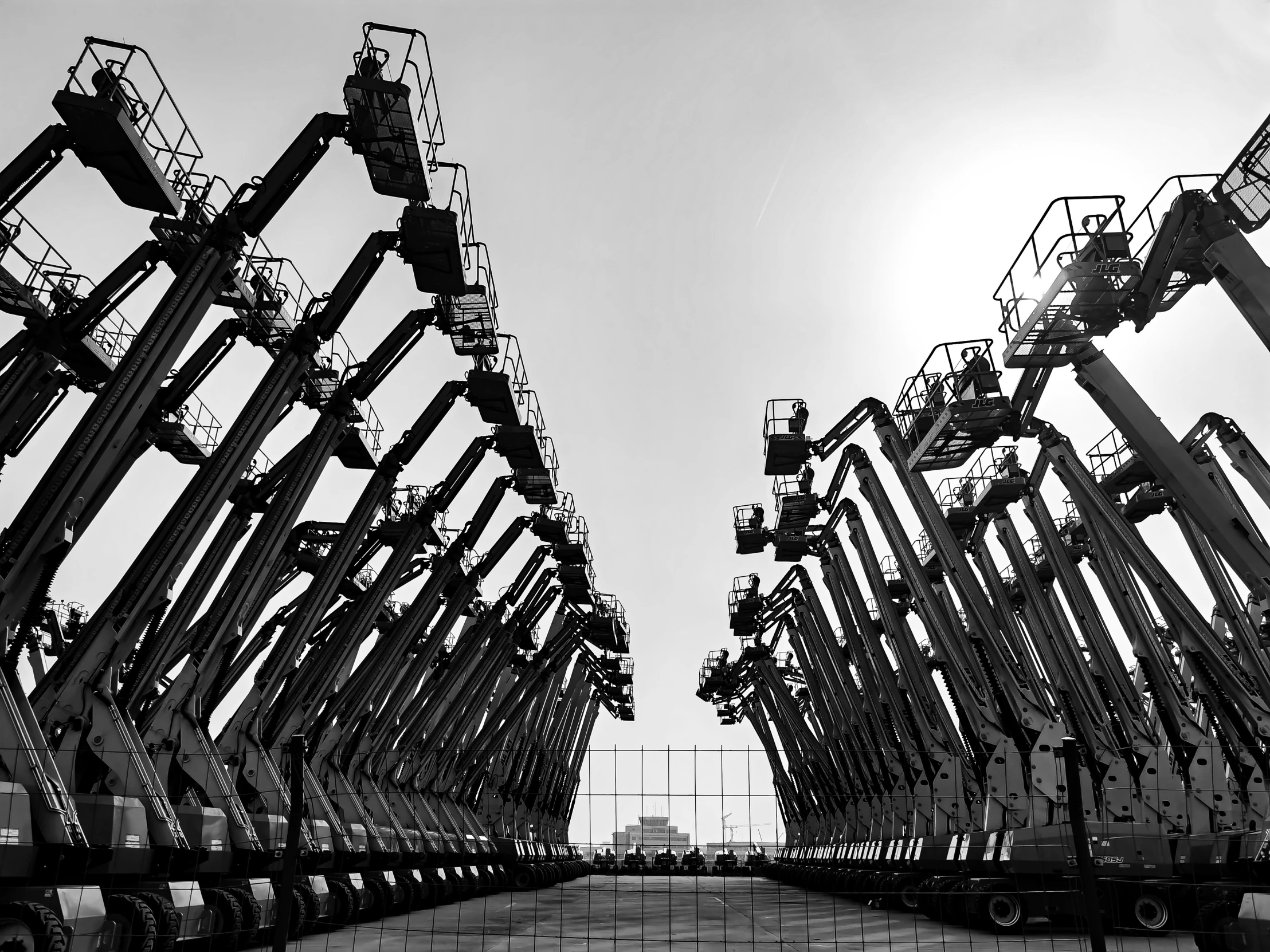 two giant metal frames in front of the sun