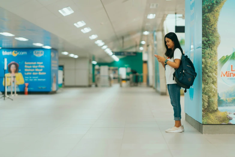 a girl is looking at her cellphone