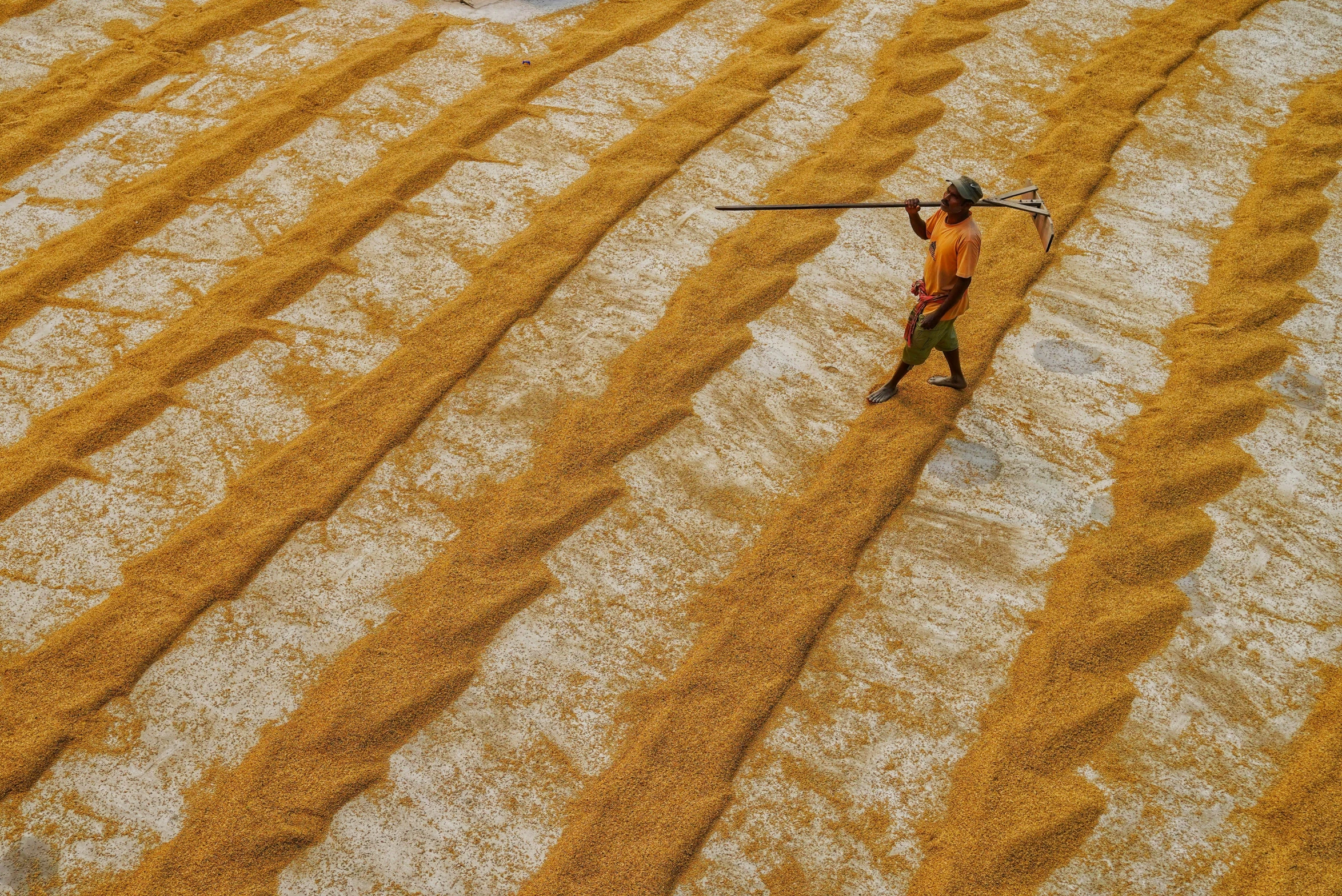 a man in yellow pants is skiing with poles