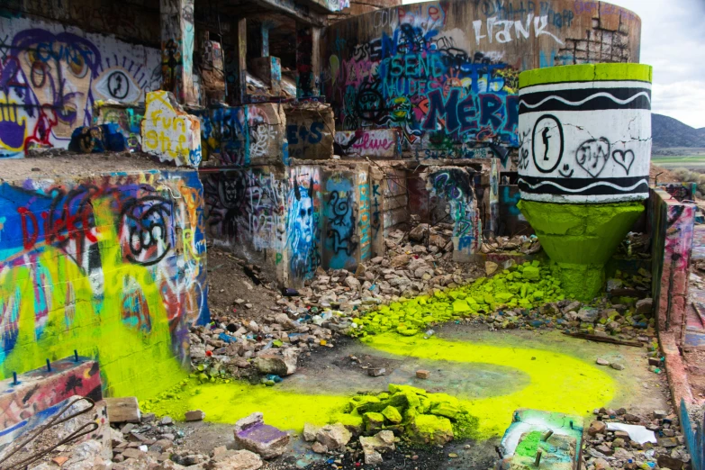 a very dirty and old building covered with graffiti