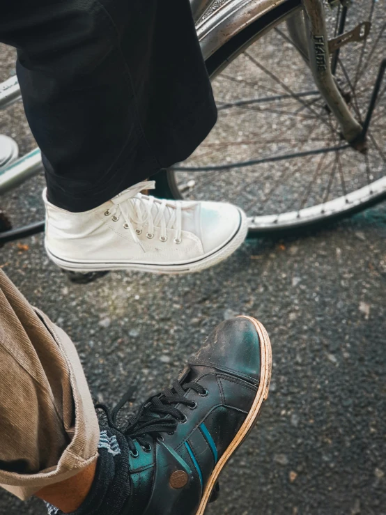 a close up of a person's shoes on the ground