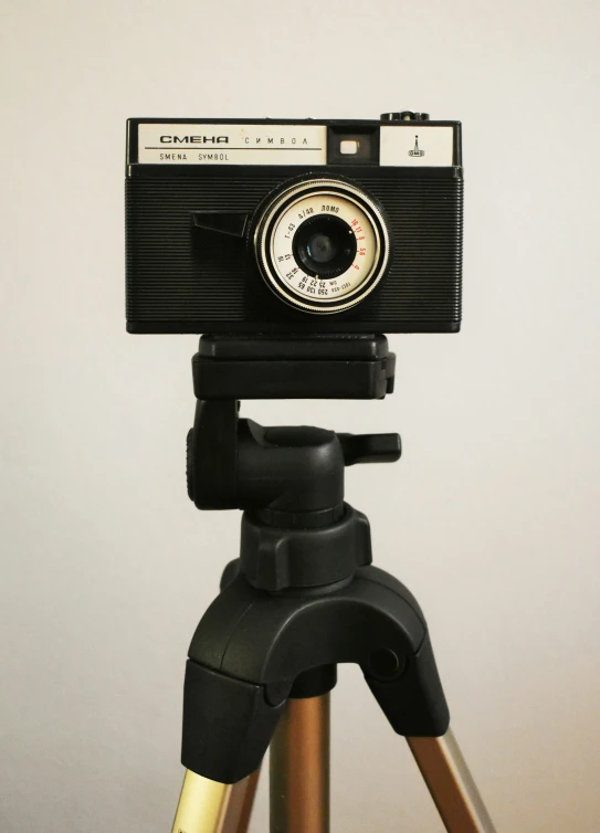 a large camera sits on top of a tripod