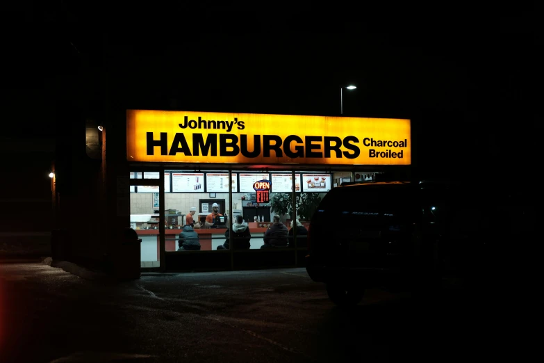 a hamburger shop at night in the dark