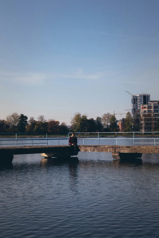 a person riding a boat on top of a large body of water