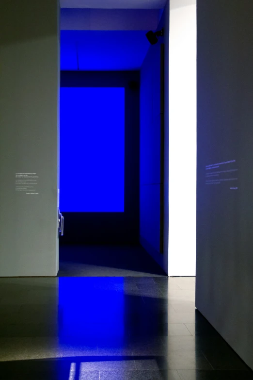 blue light in front of a doorway at a museum