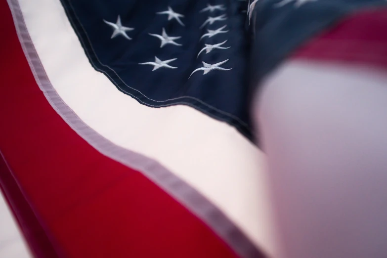 american flag on white fabric with red and blue trim