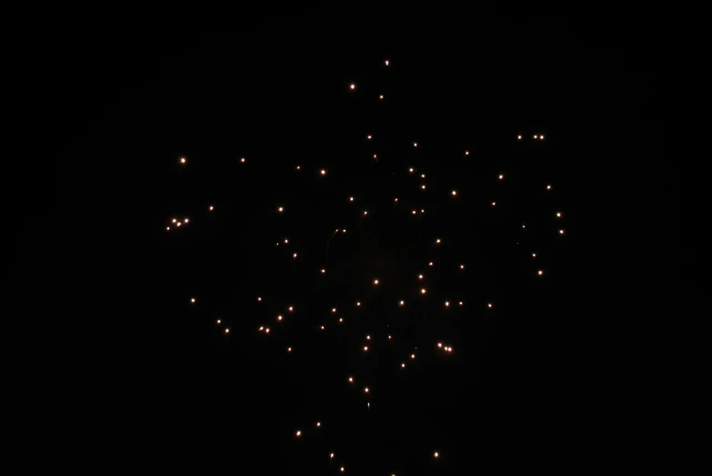 the view from below of many red fireworks