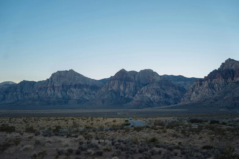 a view of mountains and a road from the air