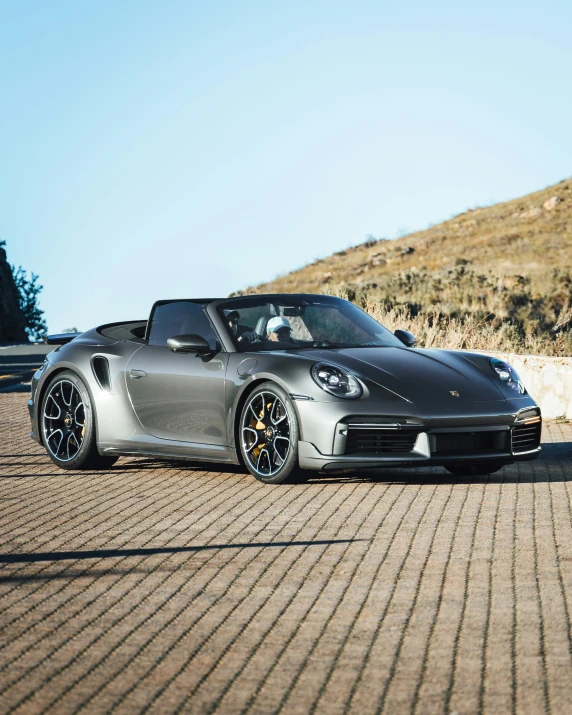 a porsche parked in the middle of a road