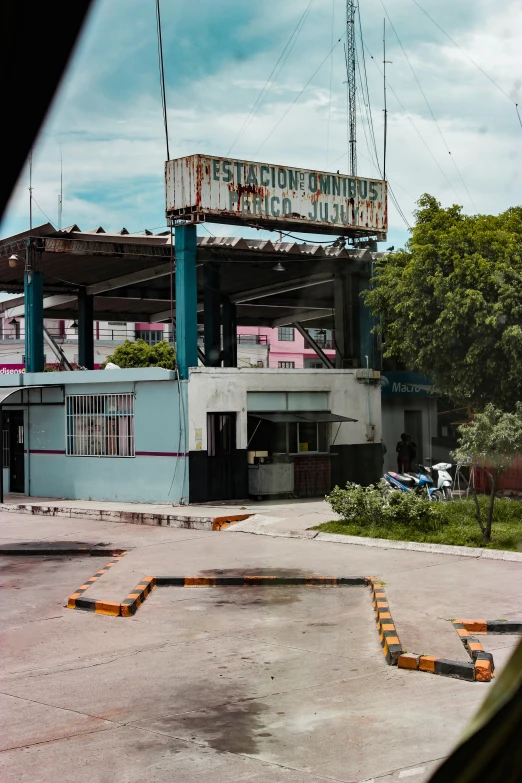 a building sitting next to a large open air field