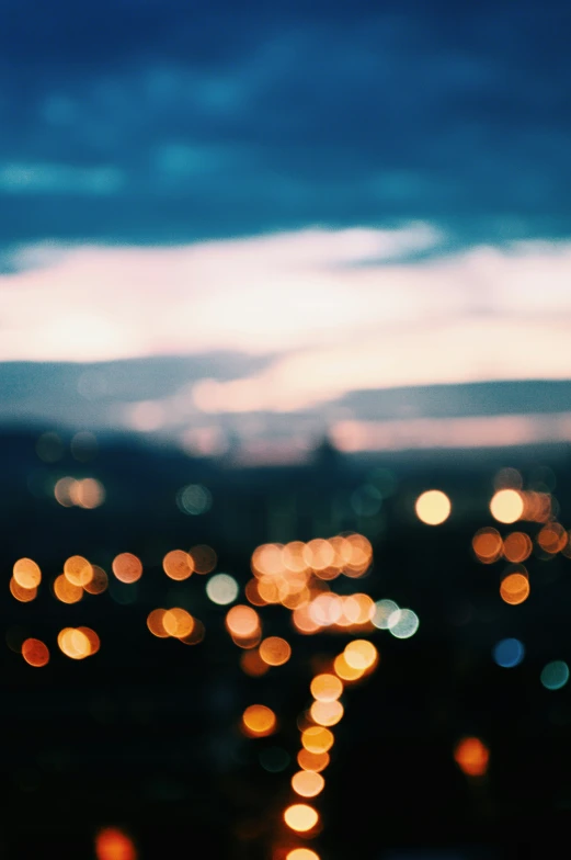 blurry pograph of the city at night as seen from above