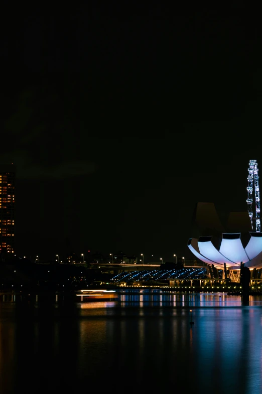 a very big tower sitting next to some water