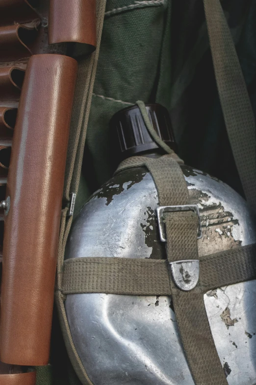 an old leather tool case is used as a gun holder