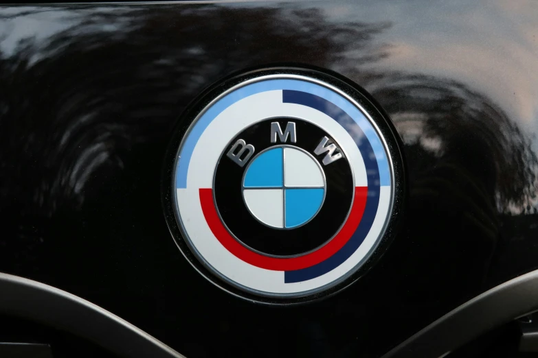 the bmw logo is displayed on a black car