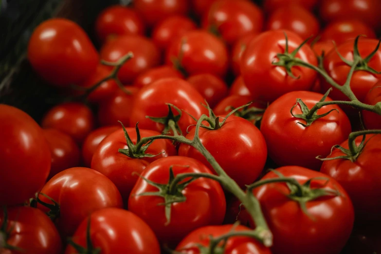 several pieces of red tomatoes are together on the table