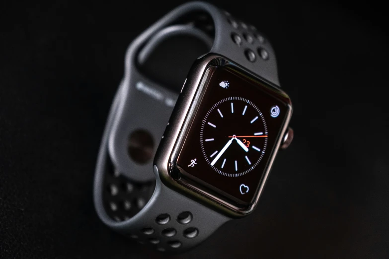 an apple watch is displayed on a black background