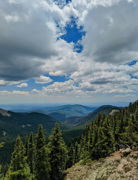 a view of the mountain range from top of a hill