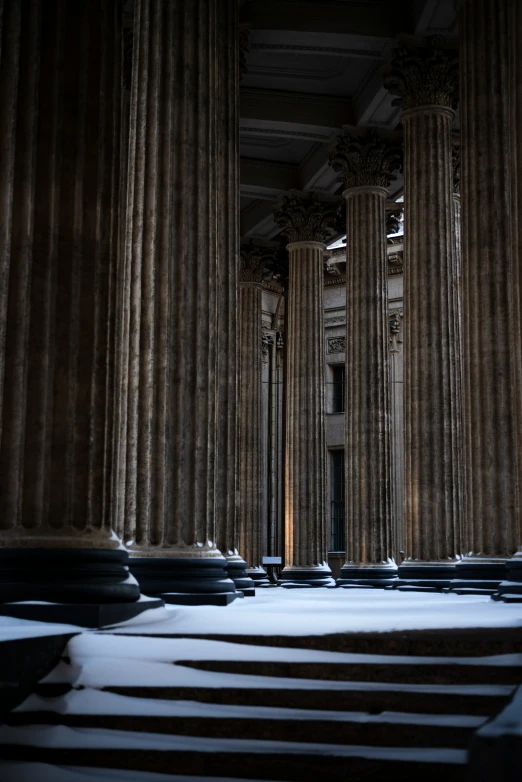 the pillars are covered in snow inside the building