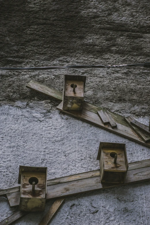 there are three pieces of wood that are standing on the ground