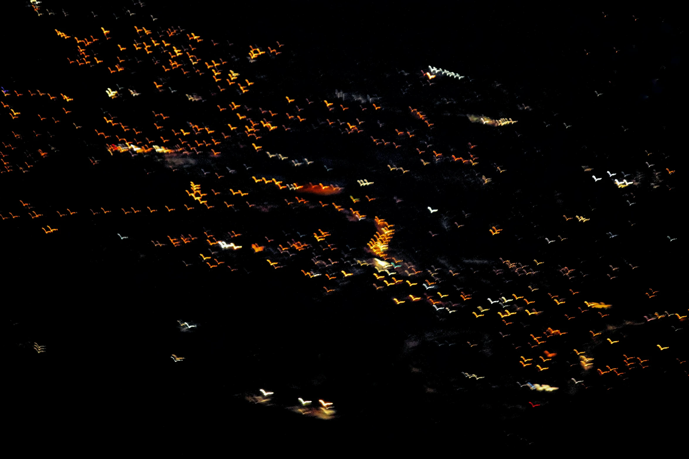 night view of a large city with lights from the windows