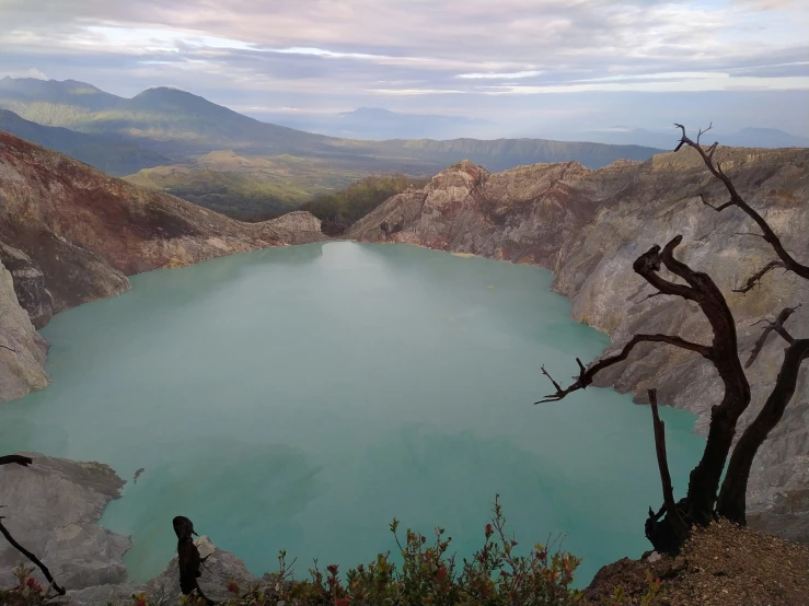 a placid blue lake surrounded by rock walls