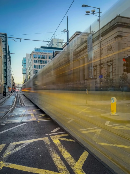 an image of a city street with the light moving through it