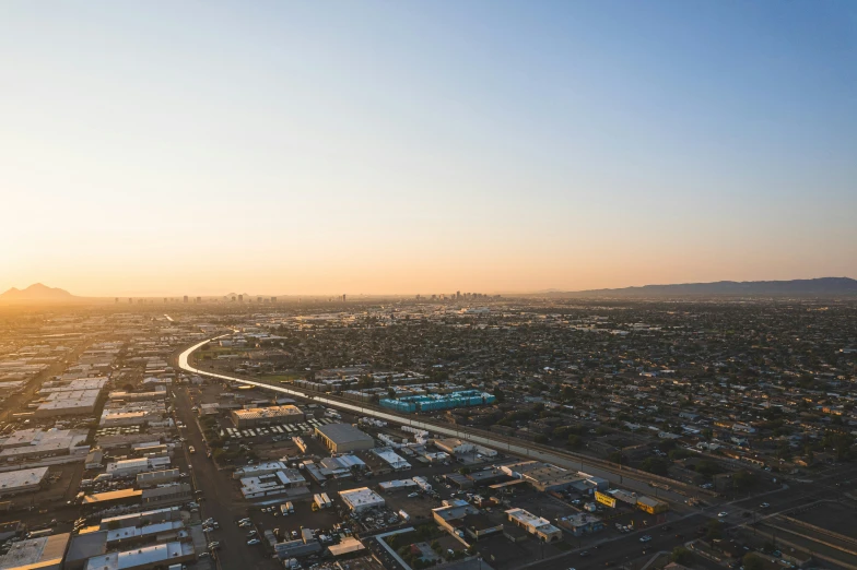 an aerial s of a highway winding into the horizon