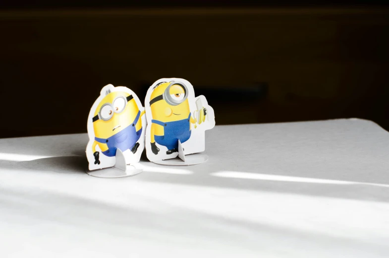 two little cute minions looking like they are eating