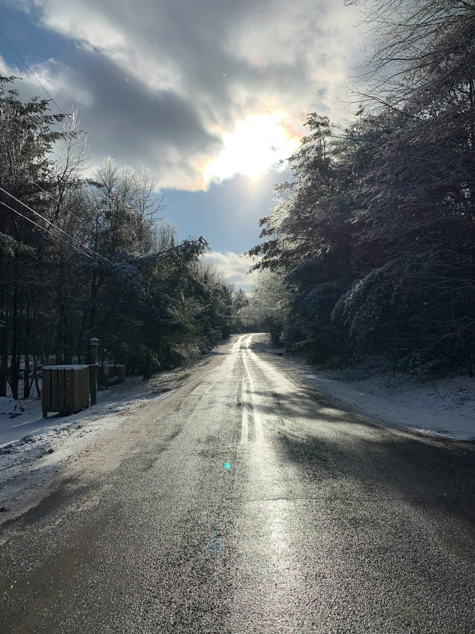 a road leading away into the sky at sunset