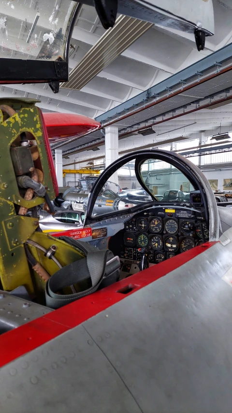 inside the cockpit area of an airplane with several vehicles and parts in the cockpit